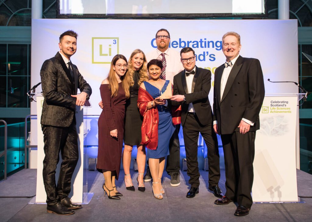 Image of Microplate Dx Limited Management team accepting the Scotland's Life Sciences Innovation - Health Technology Award 2023 from Sean Batty and Mark Cook.